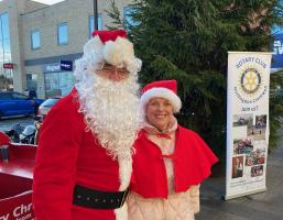 Santa with one of his hard working Elves.